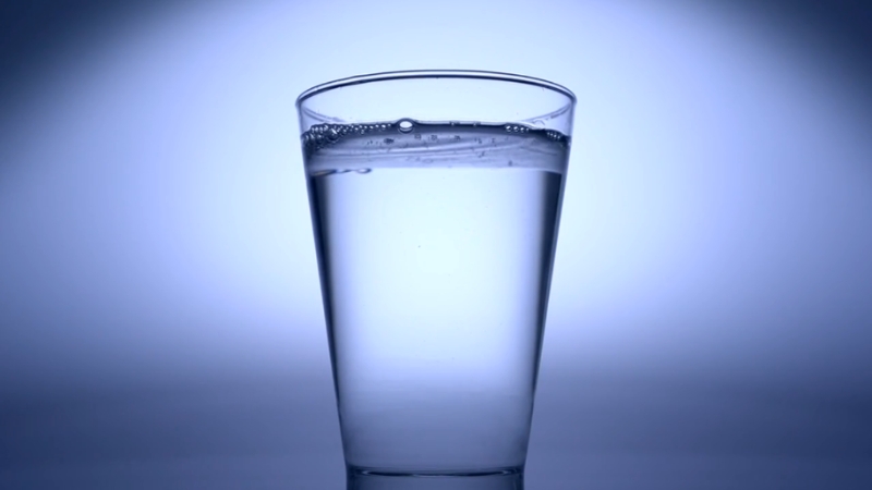 A clear glass of water shows the daily goal for the 30-Day Water Challenge